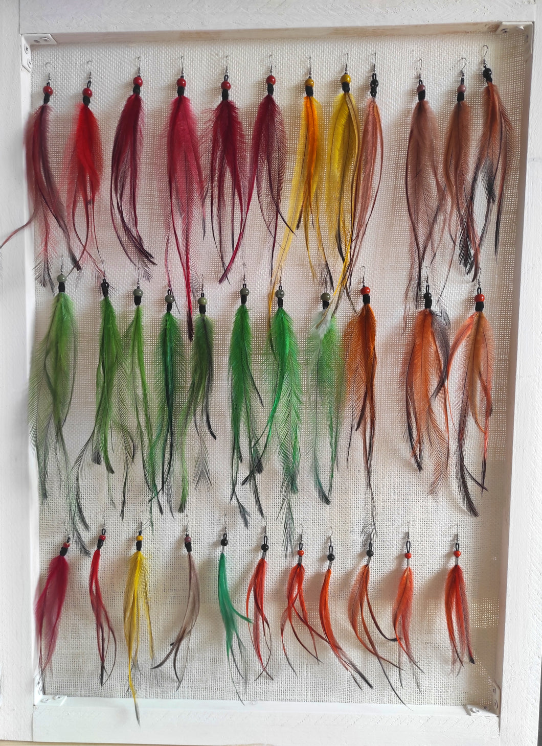 Pendientes y extensiones de plumas